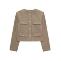 Luxurious women’s coat, golden buttons, timeless elegance.