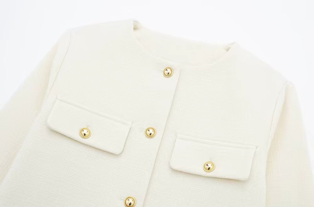 Luxurious women’s coat, golden buttons, timeless elegance.